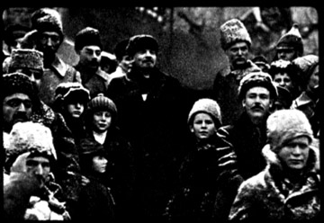 Same photo of Soviet leaders altered by Stalinist censors. Trotsky has been eliminated to the right of Lenin and Kamenev to the left. Also, the man with a heavy beard in front of Trotsky, a Georgian Bolshevik leader, has disappeared.